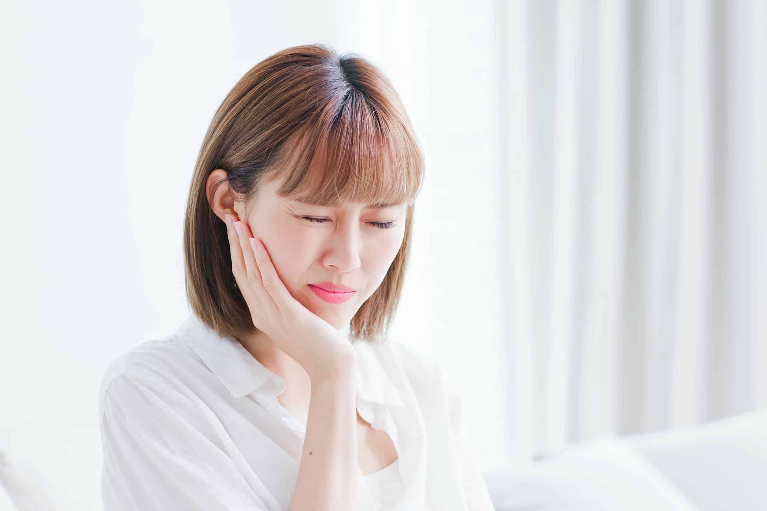 Gum disease woman feeling pain due to gum disease