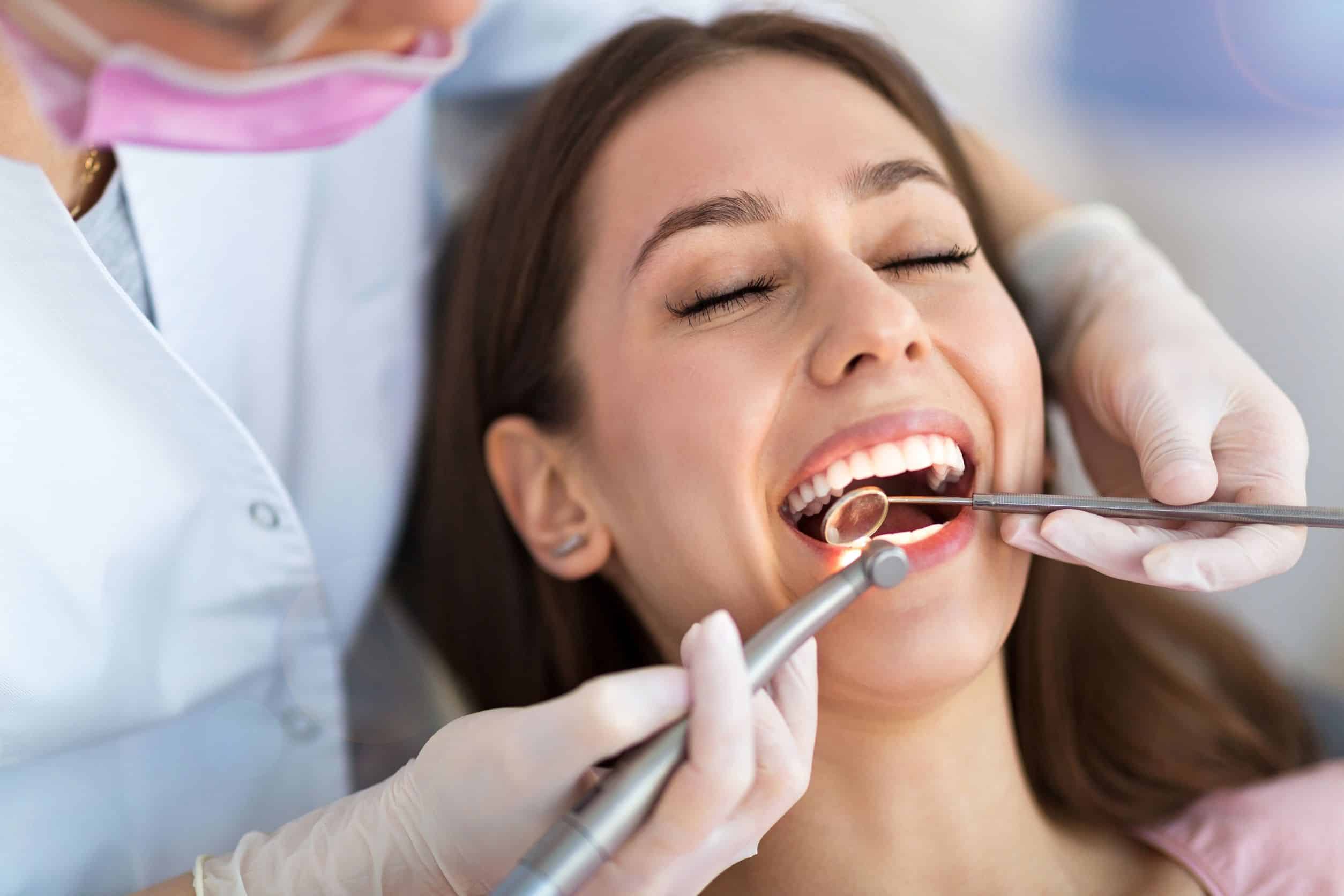 woman at the dentist; holistic dentistry concept